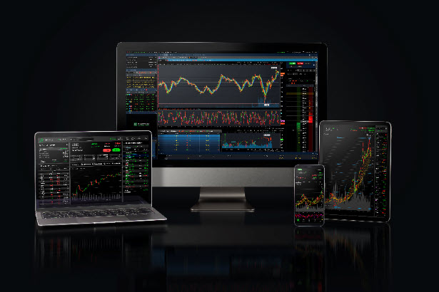 Desktop computer and tablet showing trading platform
